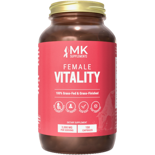 A bottle of MK Supplements Female Vitality, which appears to be a brown supplement capsule container with a gold lid. The label indicates that the product is sourced from 100% grass-fed, grass-finished cattle and contains 3,000 mg per bottle with 150 capsules.