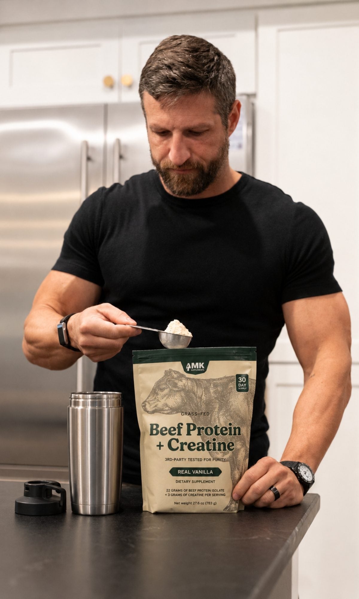 Michael Kummer scooping MK Supplements Beef Protein + Creatine into a shaker at his kitchen counter